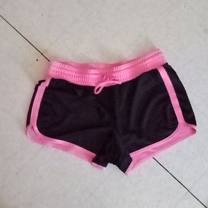 Neon pink and black running shorts